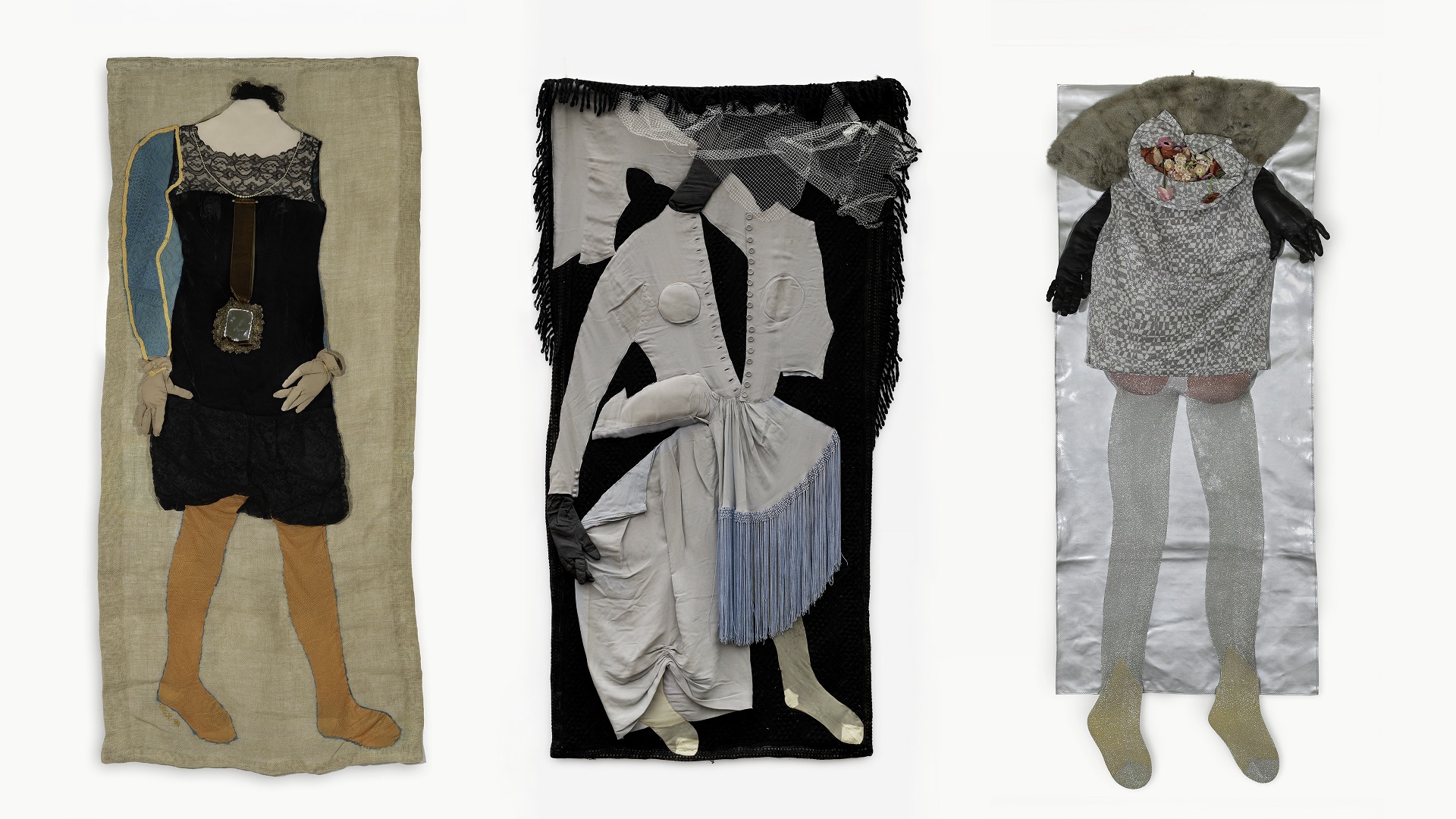 From the left: 1. Mariuccia Secol, The Doll's House No 1. (Casa di Bambola [No. 1]), 1970, patchwork of clothes, cordura, jersey, tights, 170 x 77 cm © Mariuccia Secol. Photo: Magdalena Typiak 2. Mariuccia Secol, The Doll's House. Wedding dress (Casa di bambola. Abito di sposa), 1970, patchwork of clothes, 173 x 97 cm © Mariuccia Secol. Courtesy Galerie Gisela Clement. Photo: Mareike Tocha 3. Mariuccia Secol, The Doll's House. (No. 5), (Casa di bambola [No- 5]), 1970, patchwork of clothes, canvas, fur, flowers 137 x 57 cm © Mariuccia Secol. Photo: Magdalena Typiak